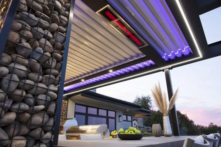 A tranquil patio cover featuring a wooden dining table, comfortable seating, and warm ambient lighting, perfect for intimate meals.