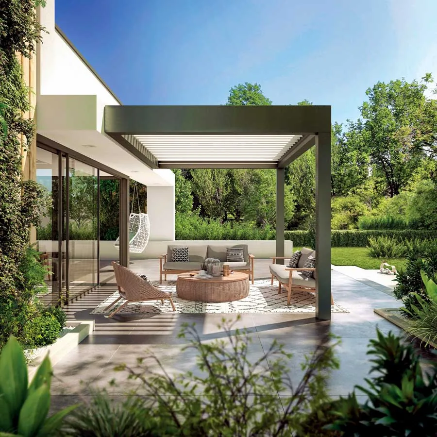 A sleek patio setup with glass railings, modern furniture, and stunning views of the surrounding landscape, perfect for relaxation.